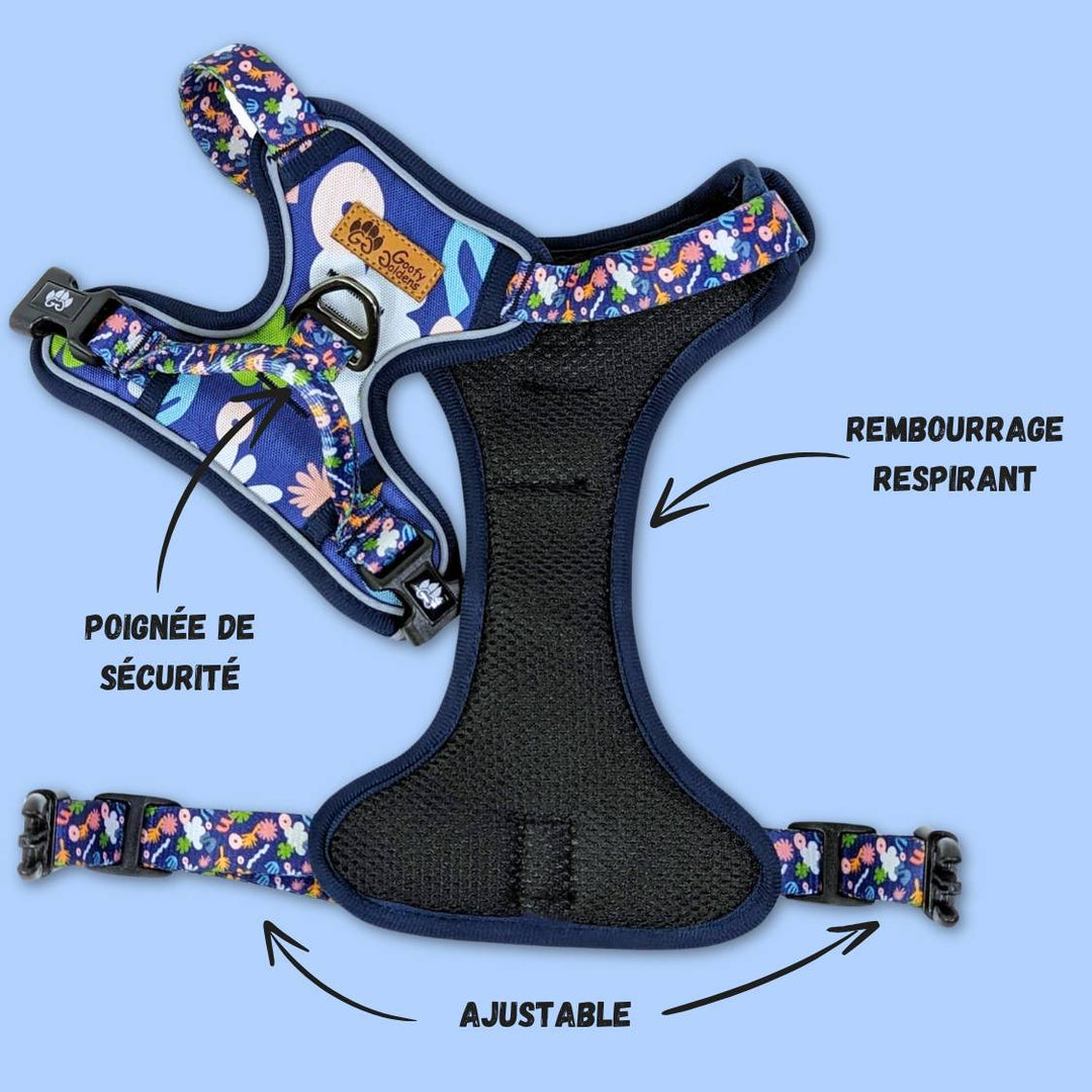 Harnais anti traction coloré aux motifs sur fond bleu marine. Harnais présenté ouvert pour distinguer le rembourrage et les boucles de fermetures