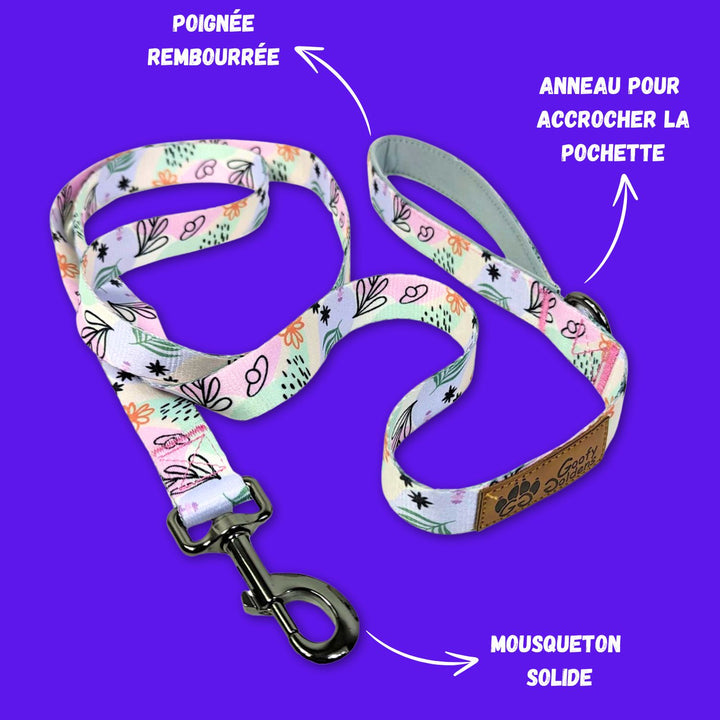 Mise en avant des motifs aux couleurs pastels Goofy Goldens ainsi que de l'anneau pour accrocher le distributeur de sacs à crottes