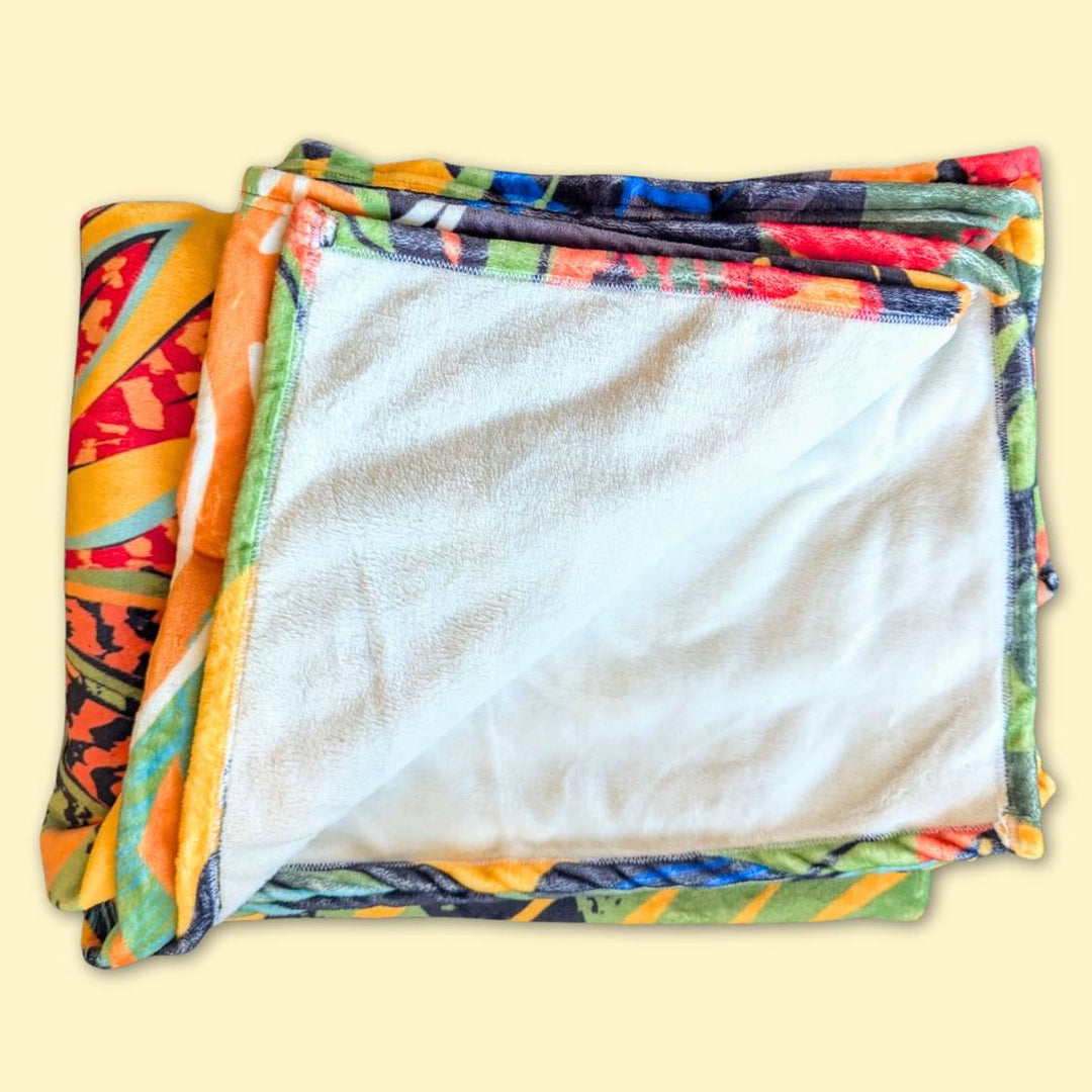 Plaid Tropical en polaire dense, ultra doux pour une chaleur maximale.